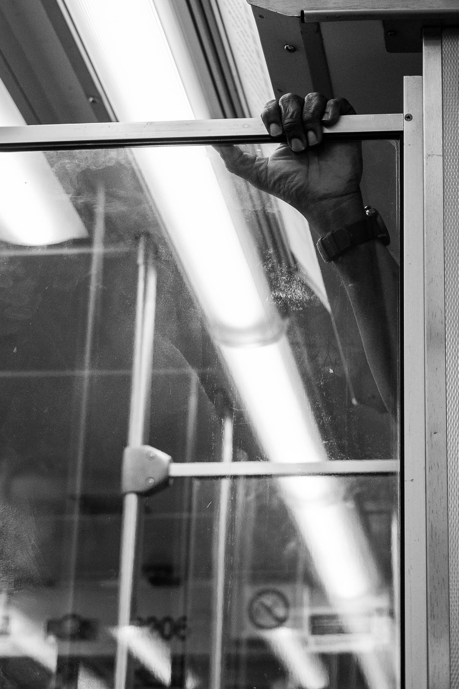 2018: Holding on. Taken on the Brown Line train between the Loop and Belmont in Chicago